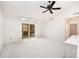 Spacious bedroom features plush carpeting, ceiling fan, and natural light from the windows at 1006 Lost Cv, Weddington, NC 28104