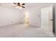 Bedroom featuring plush carpeting, ceiling fan, and ensuite bathroom at 1006 Lost Cv, Weddington, NC 28104