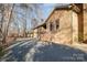 A brick home with ample parking space, and a side entry garage at 1006 Lost Cv, Weddington, NC 28104