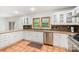 Well-equipped kitchen with stainless steel appliances, granite countertops, and tile backsplash at 1006 Lost Cv, Weddington, NC 28104