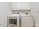 Laundry room featuring modern white appliances and neutral paint at 1006 Lost Cv, Weddington, NC 28104