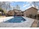 Pool featuring a deck and a wooded backyard at 1006 Lost Cv, Weddington, NC 28104