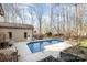 Pool featuring a deck and a backyard in a wooded neighborhood at 1006 Lost Cv, Weddington, NC 28104