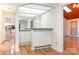 Cozy wet bar featuring granite countertops, mirrored shelving, and wood accents at 1006 Lost Cv, Weddington, NC 28104