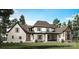 Lovely home featuring a covered patio and beautiful windows to let in natural light at 105 Redbird Ln, Weddington, NC 28104