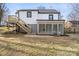 Exterior view of the home's back elevation showcasing a deck, sunroom, and well-maintained backyard at 1110 Alexander St, Statesville, NC 28677