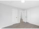 Bedroom with gray floors and three white doors at 1110 Alexander St, Statesville, NC 28677