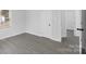 Neutral bedroom features gray floors and one window at 1110 Alexander St, Statesville, NC 28677