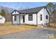 Recently updated home featuring a gravel driveway, small porch, and fresh paint at 1110 Alexander St, Statesville, NC 28677