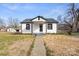 Beautifully renovated bungalow with a covered porch and fresh landscaping at 1110 Alexander St, Statesville, NC 28677