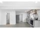Open concept kitchen with stainless steel appliances and modern gray cabinets at 1110 Alexander St, Statesville, NC 28677