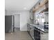 Modern kitchen featuring gray cabinets, stainless appliances, and granite countertops at 1110 Alexander St, Statesville, NC 28677