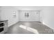 Bright and airy living area with an open concept kitchen and new flooring at 1110 Alexander St, Statesville, NC 28677