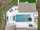 Aerial view of backyard featuring a pool, hot tub, fire pit, outdoor kitchen, and patio at 1238 Ladera Dr, Waxhaw, NC 28173
