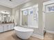 Modern bathroom showcasing a soaking tub, separate shower, and double vanity with granite countertops at 1238 Ladera Dr, Waxhaw, NC 28173