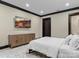 Minimalist bedroom with a large TV, wooden dresser and plush rug at 1238 Ladera Dr, Waxhaw, NC 28173