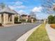 A gated community entrance showcases well-maintained landscaping and stately brick architecture at 1238 Ladera Dr, Waxhaw, NC 28173