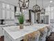 Beautiful kitchen with white cabinets, marble countertops, and modern stainless steel appliances at 1238 Ladera Dr, Waxhaw, NC 28173