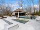 Backyard pool with a pool house, several seating areas and lush landscaping at 1238 Ladera Dr, Waxhaw, NC 28173