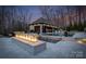 Gorgeous pool and outdoor bar area with a luxurious fire pit and comfortable seating at 1238 Ladera Dr, Waxhaw, NC 28173