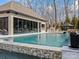 Pool featuring a pool house, an outdoor kitchen and a well maintained pool at 1238 Ladera Dr, Waxhaw, NC 28173