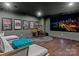 Home theater room equipped with a large screen, comfortable seating, and ambient lighting at 1238 Ladera Dr, Waxhaw, NC 28173