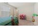 Bedroom featuring large window, carpet, and colorful storage at 1332 Augustus Beamon Dr, Indian Trail, NC 28079