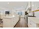 Spacious open-concept kitchen boasts a large island, modern appliances, and seamless flow to the dining area at 1332 Augustus Beamon Dr, Indian Trail, NC 28079