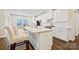Modern kitchen with white cabinets, stainless steel appliances, quartz countertops, and a stylish backsplash at 1332 Augustus Beamon Dr, Indian Trail, NC 28079