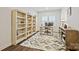 Bright office with a desk, shelving, and a stylish geometric area rug at 1332 Augustus Beamon Dr, Indian Trail, NC 28079