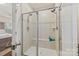 Modern tiled shower with glass doors and built-in bench at 1332 Augustus Beamon Dr, Indian Trail, NC 28079