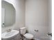 Powder room with a white pedestal sink and an octagon mirror at 14726 Tamarack Dr, Charlotte, NC 28278