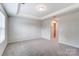 Bright bedroom featuring a tray ceiling and recessed lighting at 14726 Tamarack Dr, Charlotte, NC 28278