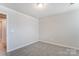 Bedroom with neutral carpet and an open doorway at 14726 Tamarack Dr, Charlotte, NC 28278