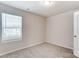 Bedroom featuring natural light and neutral colored carpet at 14726 Tamarack Dr, Charlotte, NC 28278