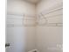 Spacious walk-in closet with wire shelving for optimal organization at 14726 Tamarack Dr, Charlotte, NC 28278