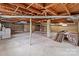Unfinished basement with concrete floors and exposed wooden ceiling at 1489 Riley St, Albemarle, NC 28001