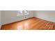 Bedroom with hardwood floors, white walls, a window and white trimmings at 1489 Riley St, Albemarle, NC 28001