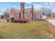Charming brick home featuring a classic design, front porch and side-entry garage at 1489 Riley St, Albemarle, NC 28001