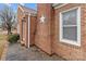 Brick home exterior showcasing brick facade, trimmed window and roofline at 1489 Riley St, Albemarle, NC 28001