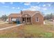Inviting brick home with a cozy front porch and a well-kept lawn at 1489 Riley St, Albemarle, NC 28001