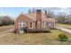 Attractive brick home featuring a cozy front porch and manicured lawn at 1489 Riley St, Albemarle, NC 28001