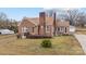 Charming brick home with a well-maintained lawn and traditional architectural details at 1489 Riley St, Albemarle, NC 28001