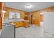 Well-lit kitchen with wood paneling, ample counter space, and updated appliances at 1489 Riley St, Albemarle, NC 28001