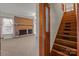 Staircase and a living room with fireplace, hardwood floors, and window at 1489 Riley St, Albemarle, NC 28001