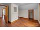 Room featuring hardwood floors, neutral walls, and wooden trim around the room at 1489 Riley St, Albemarle, NC 28001