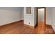 Room featuring hardwood floors, neutral walls, and wooden trim around the room at 1489 Riley St, Albemarle, NC 28001