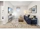 Comfortable living room with a navy sofa, patterned rug, and stylish decor at 1498 Hubert Graham Way, Tega Cay, SC 29708