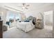 Spacious main bedroom with tray ceiling, large windows, and plush carpeting at 1498 Hubert Graham Way, Tega Cay, SC 29708