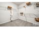 Well-organized walk-in closet with ample shelving for storage and organization at 1498 Hubert Graham Way, Tega Cay, SC 29708